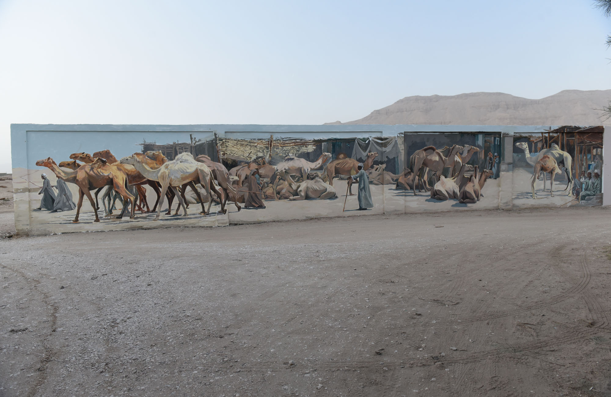 Camel Market 2025 Artist Alaa Awad paints a mural.