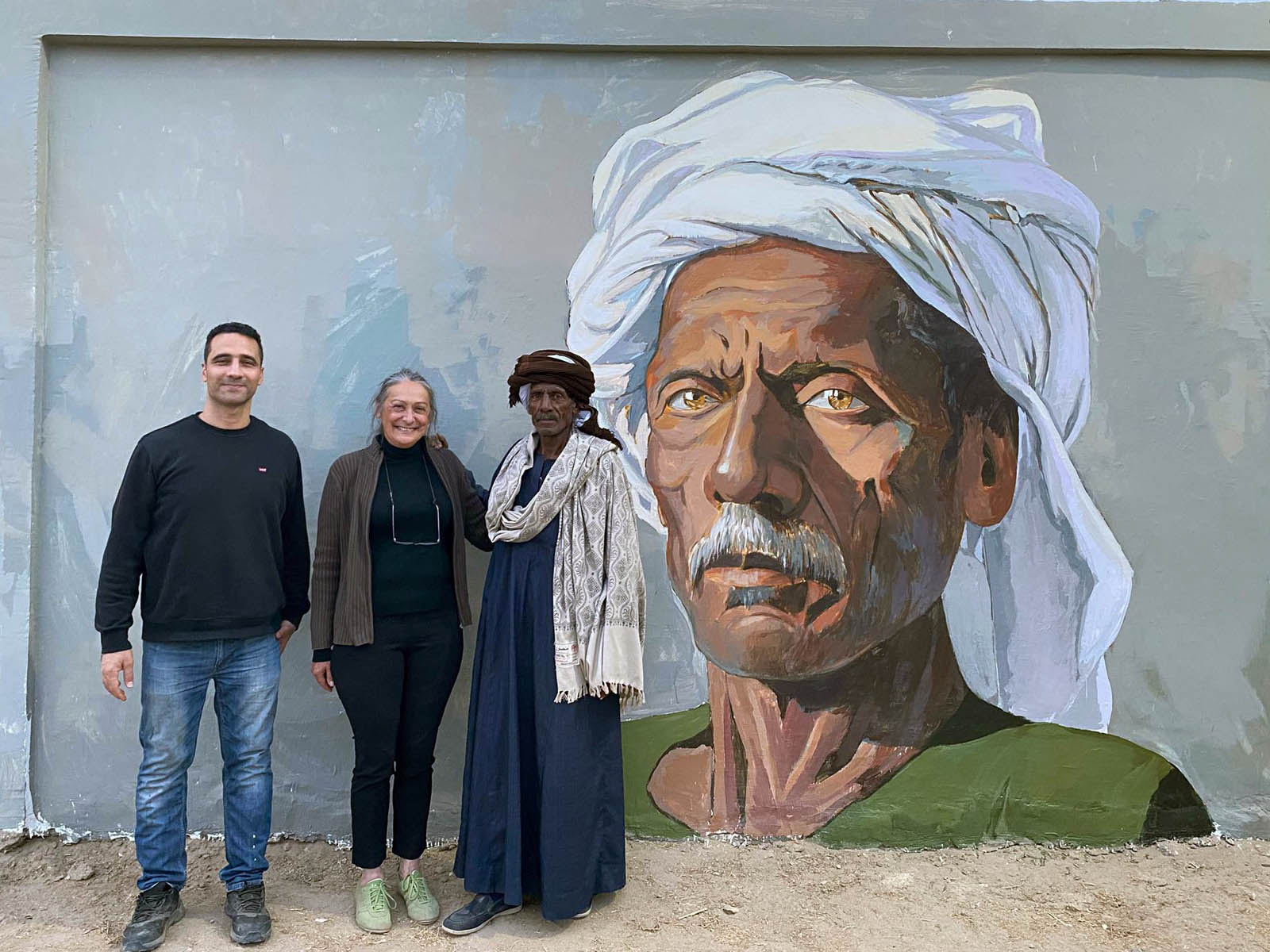 Artist Alaa Awad paints a mural.