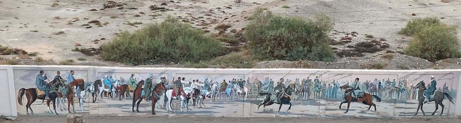 Artist Alaa Awad paints a mural.
